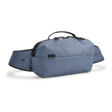 Thule Aion sling bag with adjustable strap and multiple compartments, designed for convenient carrying and organized storage.