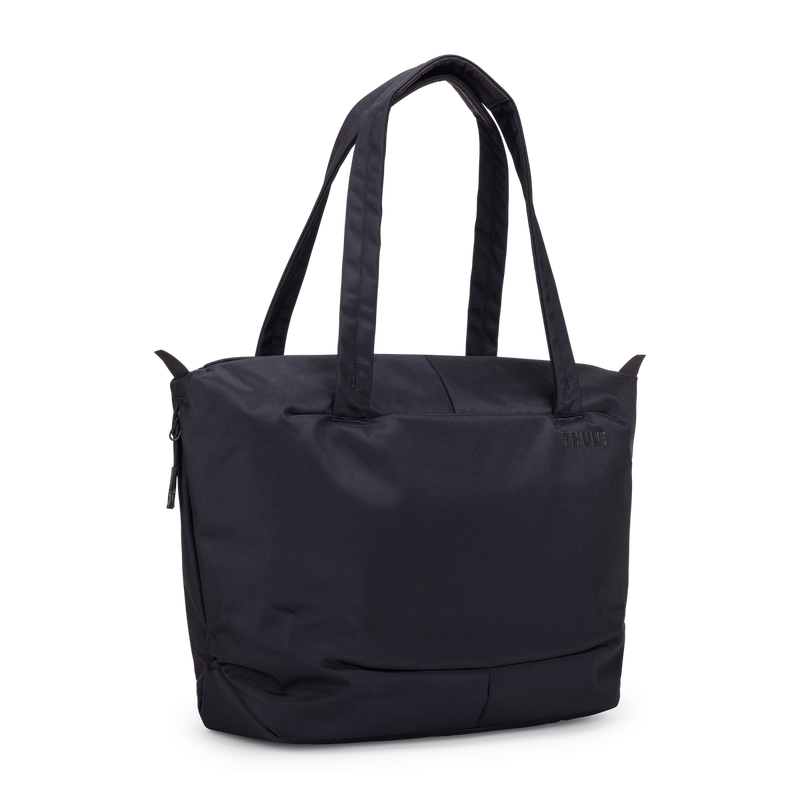 Thule Subterra 2 tote bag with black fabric, multiple compartments, and sturdy handles for versatile everyday use.