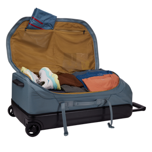 Thule Chasm wheeled checked duffel bag with sturdy handles and wheels, designed for durable travel storage.