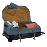 Thule Chasm wheeled checked duffel bag with sturdy handles and wheels, designed for durable travel storage.
