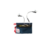 Open navy Topo Designs accessory bag showing headphones and small personal items inside. Durable, compact travel accessory.