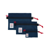 Navy blue Topo Designs accessory bag with zipper closure, compact and versatile for organizing small items.