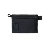 Black Topo Designs accessory bag shown with multiple compartments, compact and durable for organizing small items.