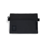 Medium black Topo Designs accessory bag with durable fabric and zippered compartments, ideal for organizing small essentials.