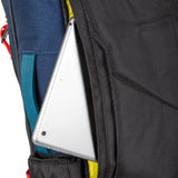 Topo Designs Global Travel Bag 30L backpack with multiple compartments and adjustable straps, shown in close-up detail.