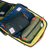 Topo Designs Global Travel Bag 30L backpack with multiple compartments, durable fabric, and adjustable straps, shown in detail.