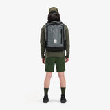 Topo Designs Global Travel Bag 30L backpack in olive, showing full back view with adjustable straps and multiple compartments.
