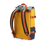 Topo Designs Rover Pack Mini backpack in recycled navy and mustard with front pocket and adjustable straps.