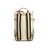Topo Designs Rover Pack Mini backpack in bone white and beetle green, showing the compact design and adjustable straps.