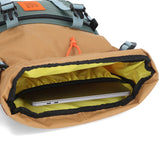 Topo Designs Rover Pack Classic backpack in recycled forest khaki with front zip pocket and sturdy shoulder straps.