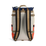 Topo Designs Rover Pack Classic backpack in almond and emberglow, showing front view with adjustable straps and spacious interior.