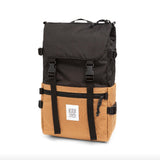 Topo Designs Rover Pack Classic backpack with adjustable straps and multiple compartments, shown in a natural outdoor setting.