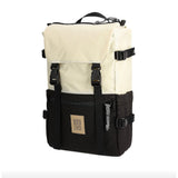 Topo Designs Rover Pack Classic backpack showing durable fabric, multiple compartments, and adjustable straps on a neutral background.