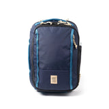Topo Designs Global Travel Backpack in gray with multiple compartments and padded straps, designed for comfort and durability.