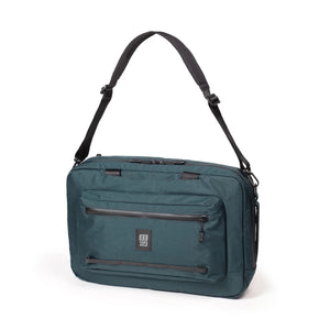 Topo Designs Global Pro 3-Way Briefcase in black, showing adjustable straps and multiple compartments for versatile carrying options.