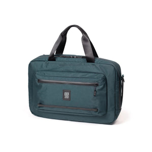 Topo Designs Global Pro 3-Way Briefcase with sturdy handles and adjustable shoulder strap, made of durable fabric in black.