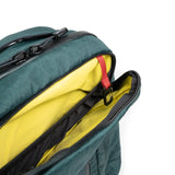Large view of the Topo Designs Global Pro Backpack showing its black durable fabric, multiple compartments, and padded shoulder straps.