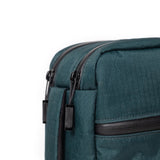 Topo Designs Global Pro Tech Case in black with zipper closure, durable nylon exterior, and multiple compartments for tech accessories