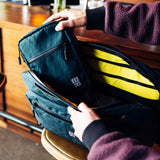 Topo Designs Global Pro Tech Case in black with multiple compartments, durable nylon exterior, and sleek design.