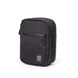 Large image of the Topo Designs Global Pro Tech Case, featuring durable black fabric with secure zipper closure and compact design.