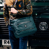 Topo Designs Global Pro Travel Tote in large view, featuring durable fabric, multiple compartments, and sturdy handles for travel.