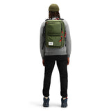 Topo Designs Global Briefcase in green and black, shown from the back with adjustable strap and durable fabric for professional use.