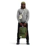 Topo Designs Global Briefcase in green and black, showing detailed view of durable fabric and sleek design for professional use