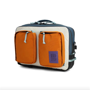 Topo Designs Global Briefcase made of durable fabric, featuring multiple compartments and a sturdy handle for professional carrying.
