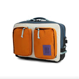 Topo Designs Global Briefcase made of durable fabric, featuring multiple compartments and a sturdy handle for professional carrying.