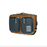 Topo Designs Global Briefcase showing rugged canvas and leather accents, with sturdy handles and organizational compartments inside.