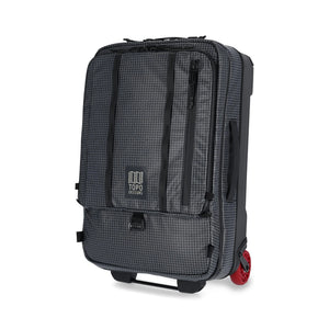 Topo Designs Apex Roller carry-on luggage in black with a grid pattern, showcasing its durable design and compact size.