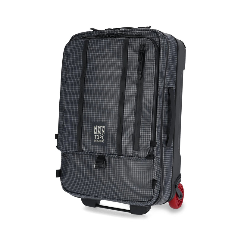 Topo Designs Apex Roller carry-on luggage in black with a grid pattern, showcasing its durable design and compact size.