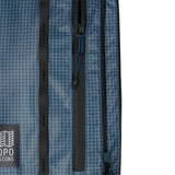 Topo Designs Apex Roller carry-on luggage in Pond Blue Grid, with durable wheels and compact design for travel convenience.