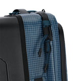 Topo Designs Apex Roller carry-on luggage in Pond Blue Grid with durable fabric and sleek design for travel convenience.