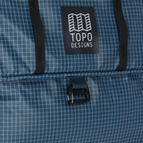 Topo Designs Apex Roller carry-on luggage in Pond Blue Grid with durable wheels and sleek design.