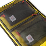 Topo Designs Global Travel Bag 40L carry-on luggage with durable fabric, multiple compartments, and adjustable straps.