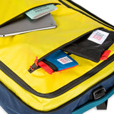 Topo Designs Global Travel Bag 40L carry-on luggage with durable fabric, multiple zippers, and adjustable straps for convenient travel.