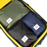 Topo Designs Global Travel Bag 40L carry-on luggage with durable fabric, multiple compartments, and adjustable straps for travel.