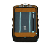 Topo Designs Global Travel Bag 40L carry-on luggage in desert palm and pond blue, front view showing durable design and spacious interior.