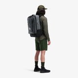 Olive green Topo Designs Global Travel Bag 40L carry-on luggage with multiple compartments and durable fabric, detailed view.
