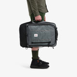 Topo Designs Global Travel Bag 40L carry-on luggage in olive with full layer detail and sturdy handles.