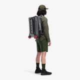 Olive green Topo Designs Global Travel Bag roller carry-on luggage with multiple compartments and sturdy wheels.