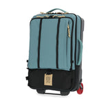 Topo Designs Global Travel Bag Roller carry-on luggage in SeaPine color with multiple compartments and durable wheels.