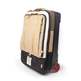 Topo Designs Global Travel Bag roller carry-on luggage with durable fabric, wheels, and a sleek design, ready for travel.