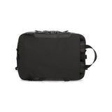 Black Topo Designs Apex Briefcase, a convertible briefcase with sleek design and sturdy handle, versatile for professional use.