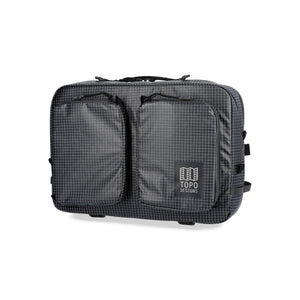 Black Apex Briefcase by Topo Designs, convertible briefcase with sturdy straps and multiple compartments for versatile use.