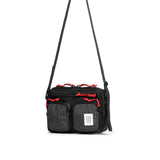 Topo Designs Block Bag crossbody bag with adjustable strap, durable fabric, and front pockets, shown in a large view.