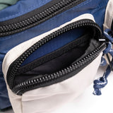 Topo Designs Block Bag crossbody bag with adjustable strap, durable fabric, and front pocket, shown on a plain background.