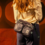 Topo Designs Block Bag crossbody bag with adjustable strap, durable fabric, and front pocket, shown on a neutral background.
