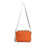 Topo Designs Block Bag crossbody bag with adjustable strap and front pocket, made of durable fabric, shown in black.